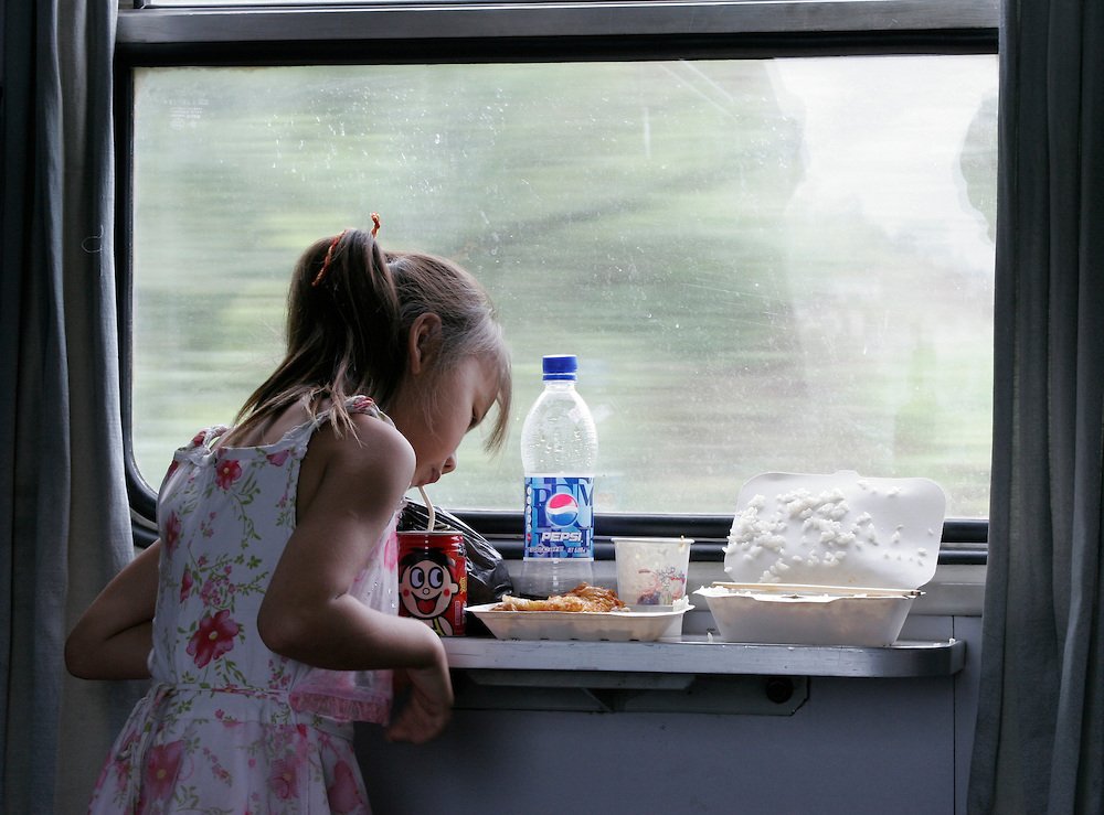 Girl-eating-on-train